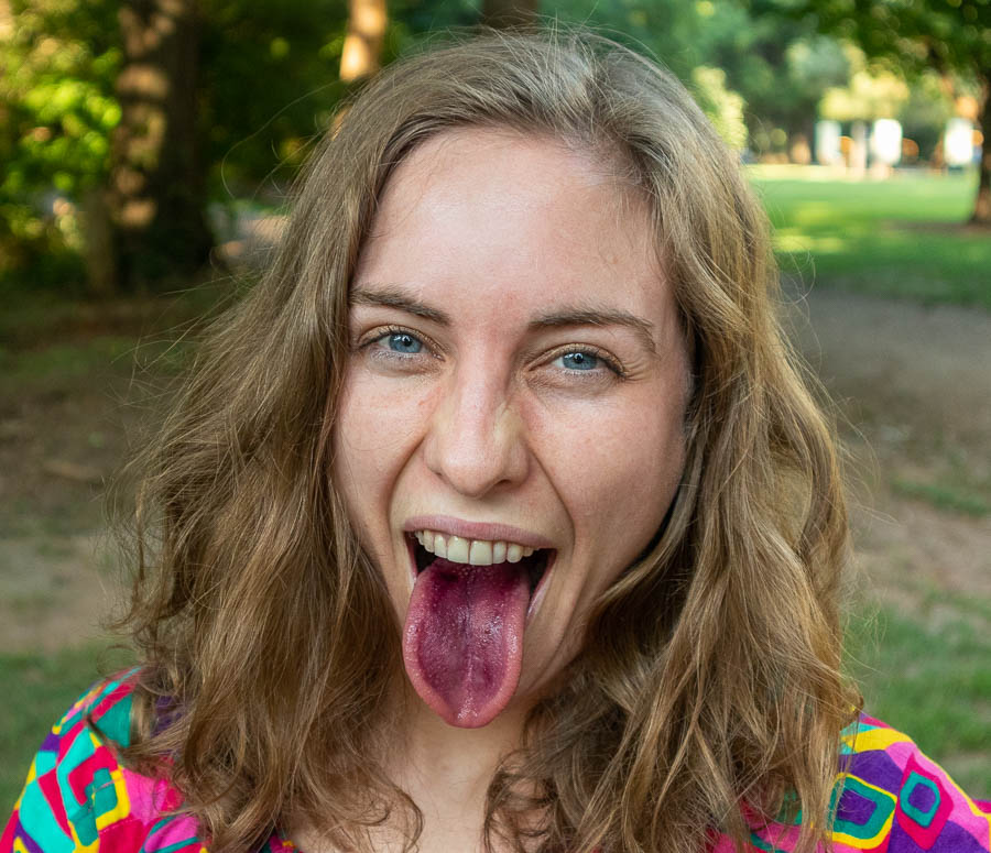 Carolyn tasting some wild black cherries