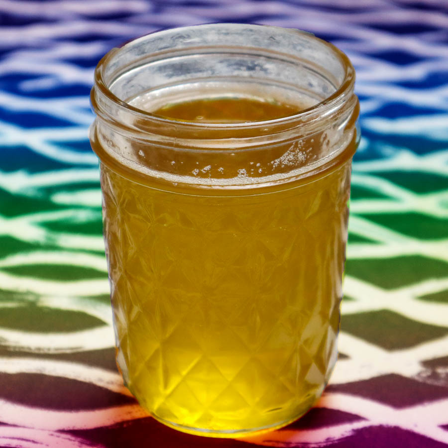 Spruce-infused ghee on a rainbow cloth