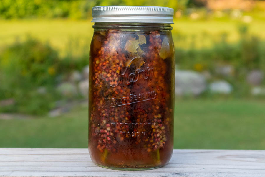 Minty sumacade brewing in a jar